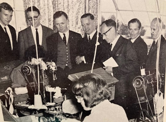 Visitors observing a stitcher at work in Morlands
Photo: Morlands Magazine, Christmas 1965